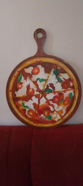 Wooden chopper board with pizza art